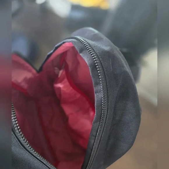 Black Herschel Backpack with Red and White Striped Interior - Picture 4 of 5